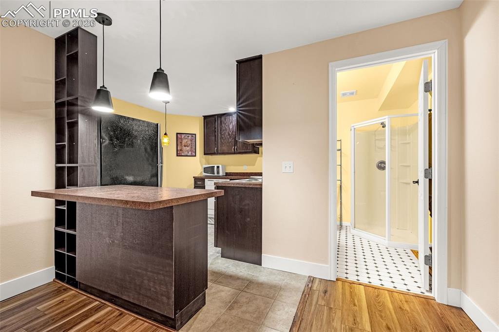 Basement level living area has full kitchen and 3/4 bathroom