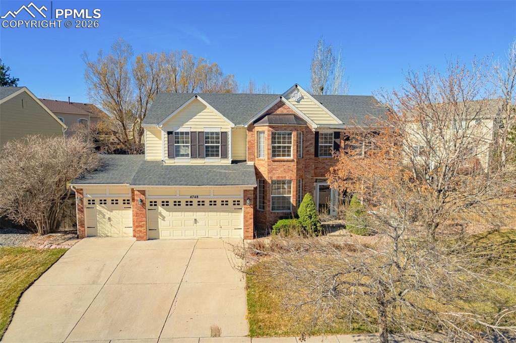An exceptional classic, brick and stone accent this 3 car garage home