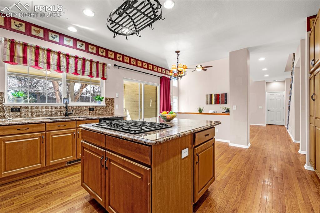 Large island features gas top range and plenty of storage below