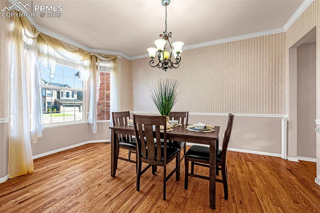 A classic bay window accents the room with natural light