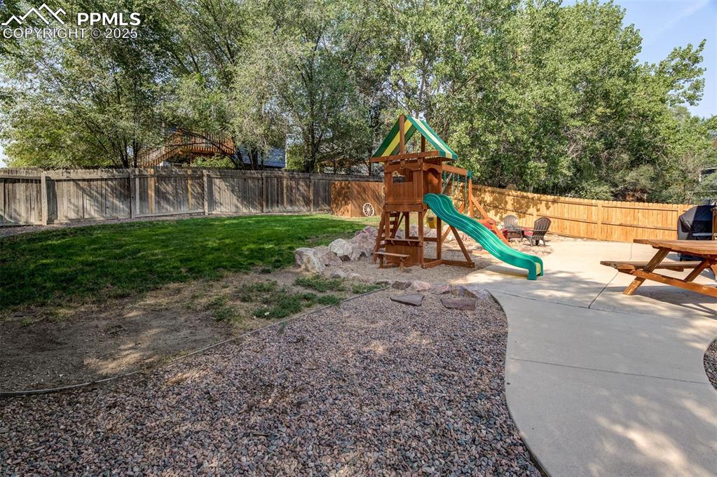 Fully fenced back yard and play area stays!!!!