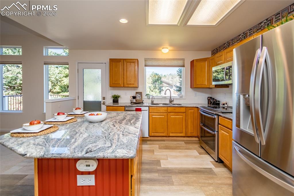 Check out the exotic granite island and counters.