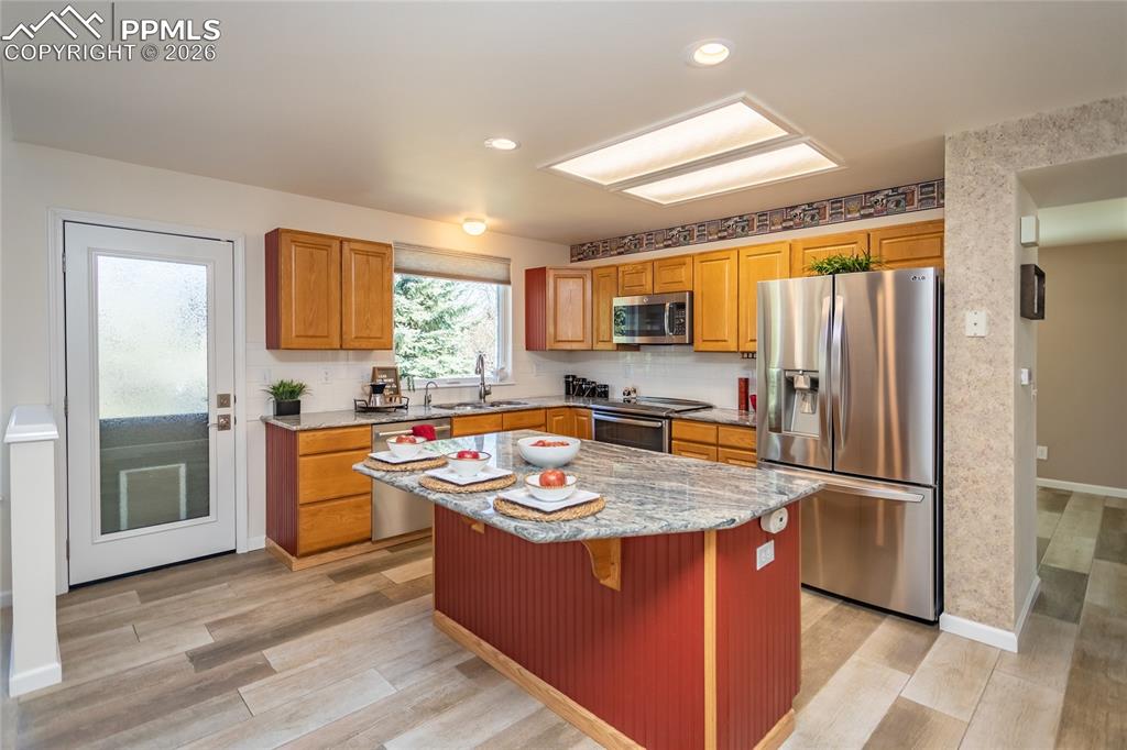 The kitchen walks out to the large deck which overlooks the back yard.