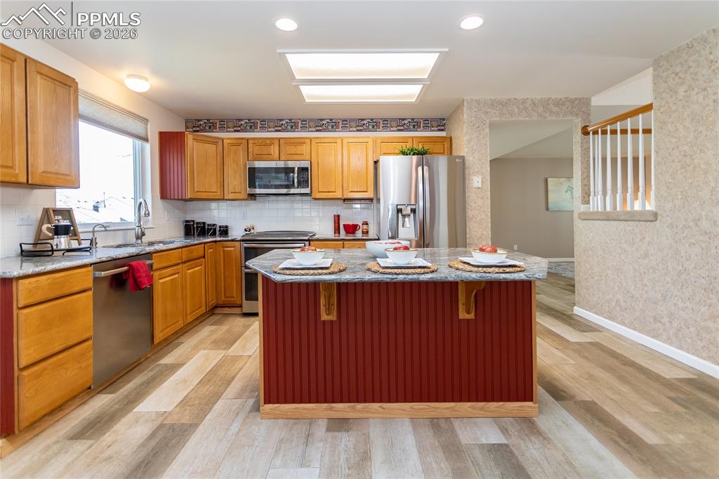 Again, extensive woodlook tile flooring is warmly welcoming.