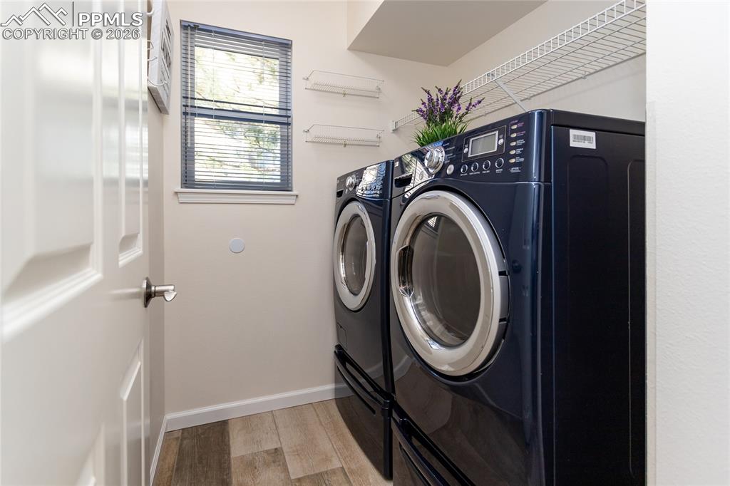 The laundry room comes equipped with LG W/D with pedestal storage.