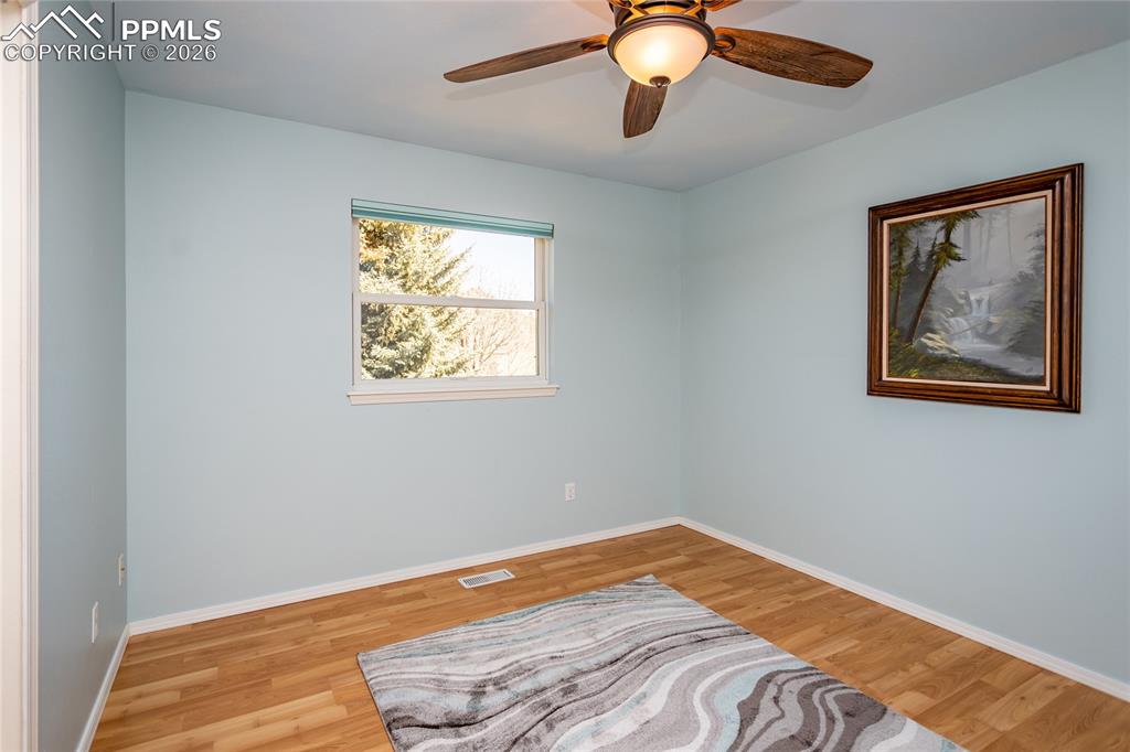 The 3rd bedroom upstairs faces west with views of the bluffs.