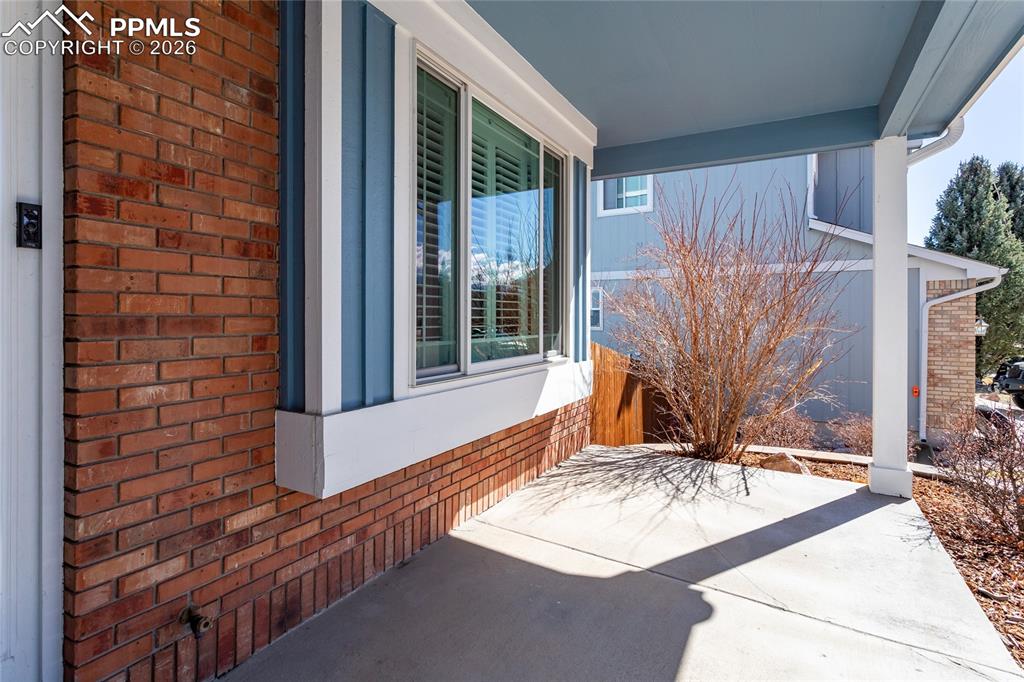 Welcoming front porch is just waiting for your porch swing!