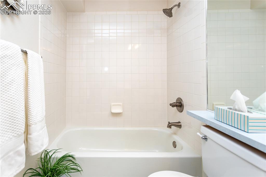 4th bathroom is a full bath, and graced with neutral color pallet.