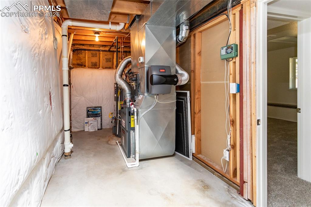 The utility room is 16 feet long, also offering abundant storage.