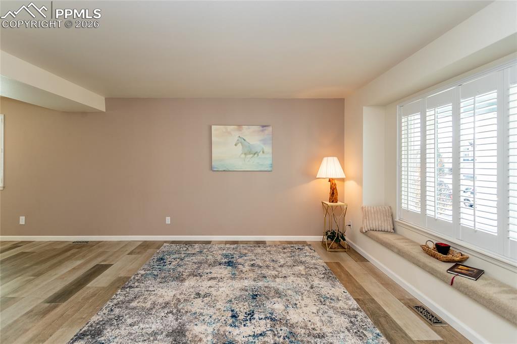 Large living room with window seat for relaxing and watching the world