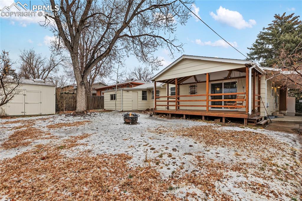 Fenced, level back yard - includes storage shed in addition to the workshop!