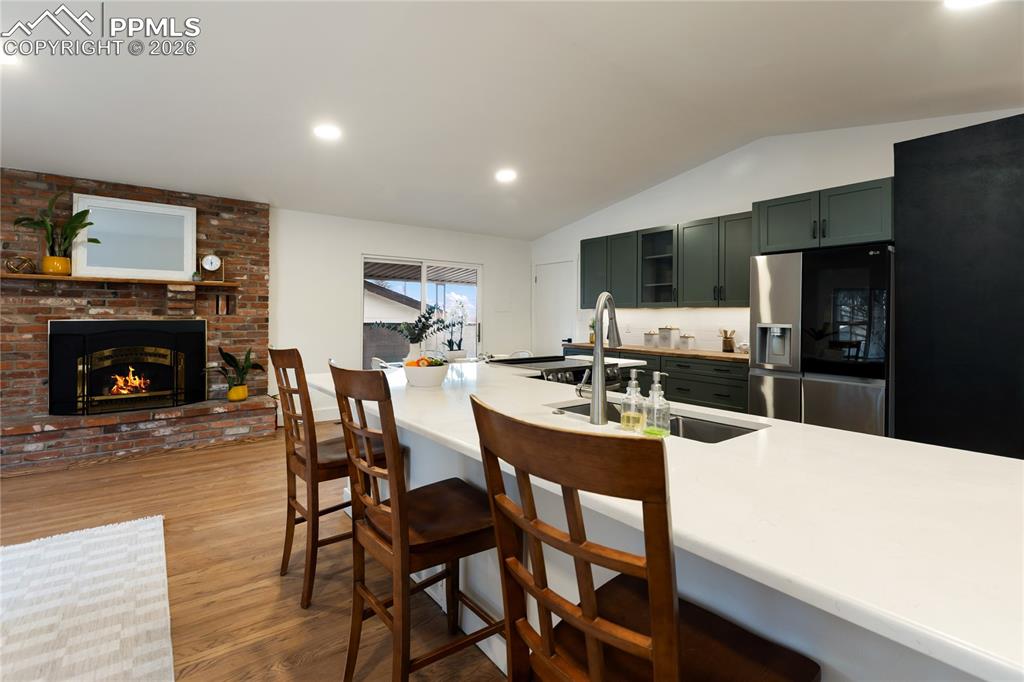 Open concept kitchen/dining and living room.  Walk out to the covered concrete patio!