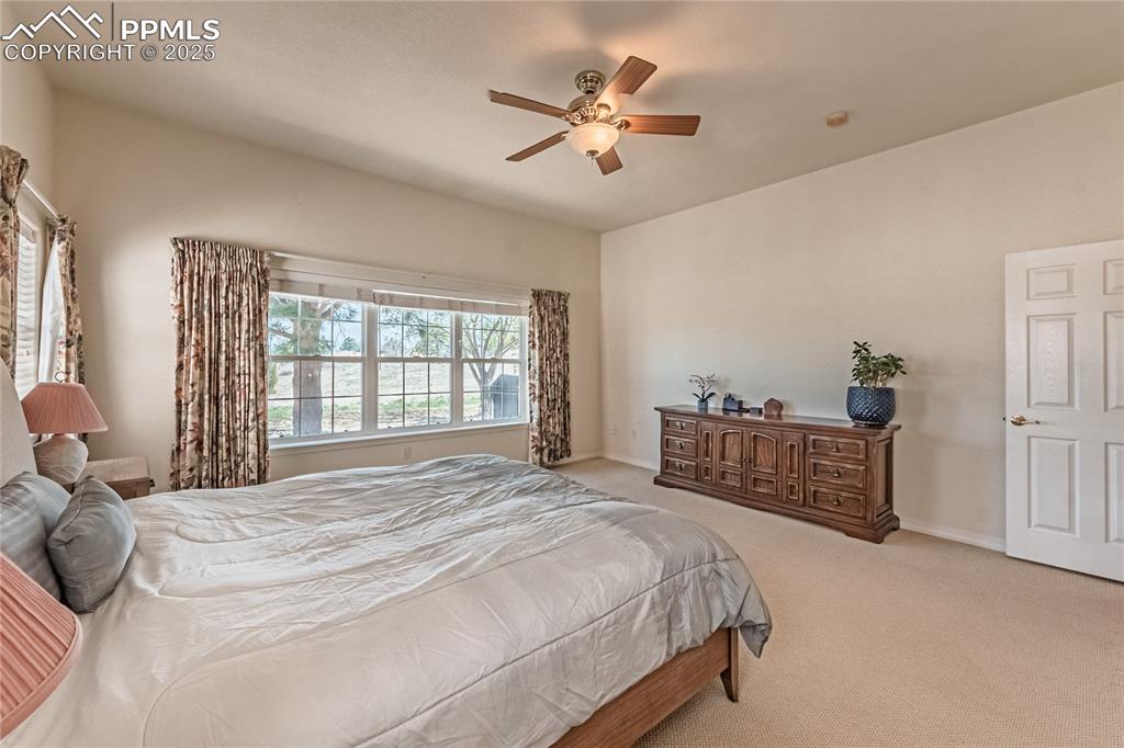 Bedroom featuring carpet and a ceiling fan