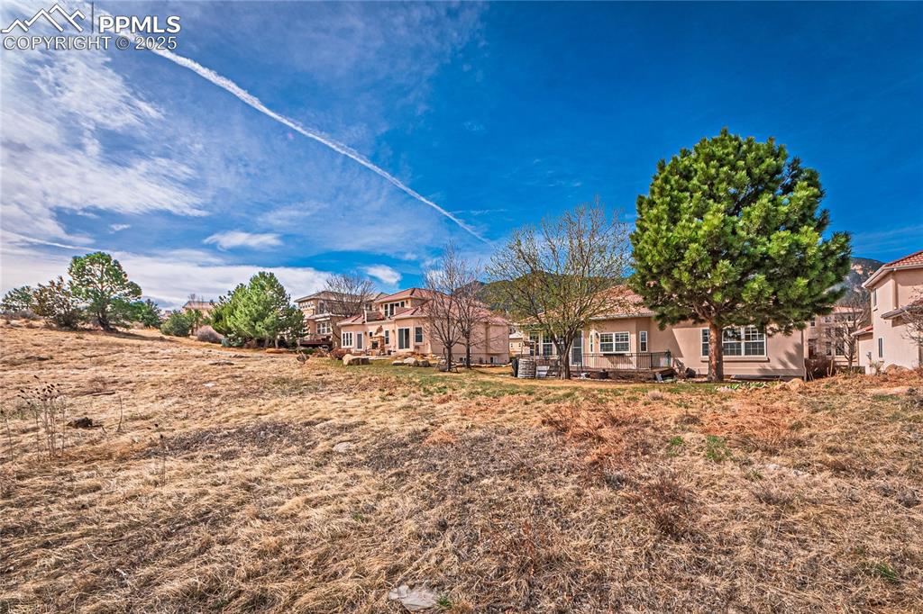 Rear view of property with stucco siding