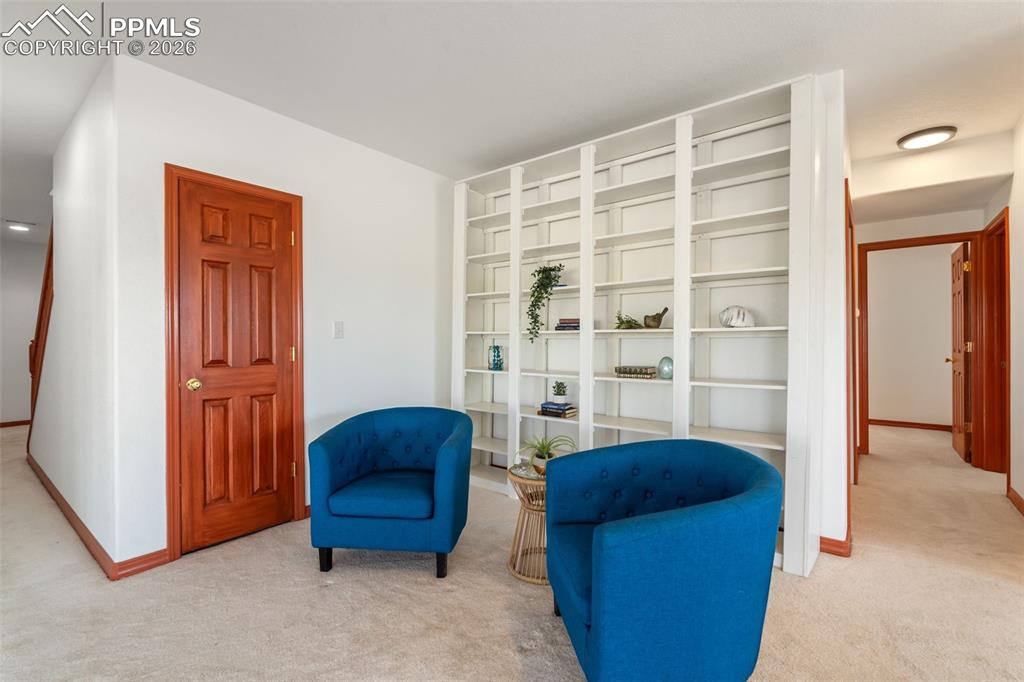 Large open area in basement, walks out to lower deck