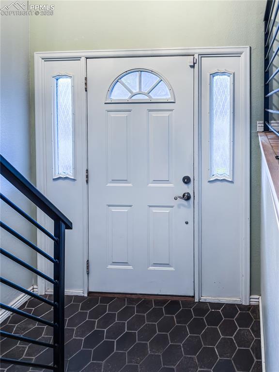 Entryway featuring stairs