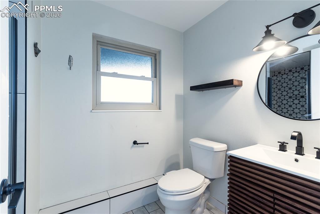 Bathroom featuring vanity and a shower