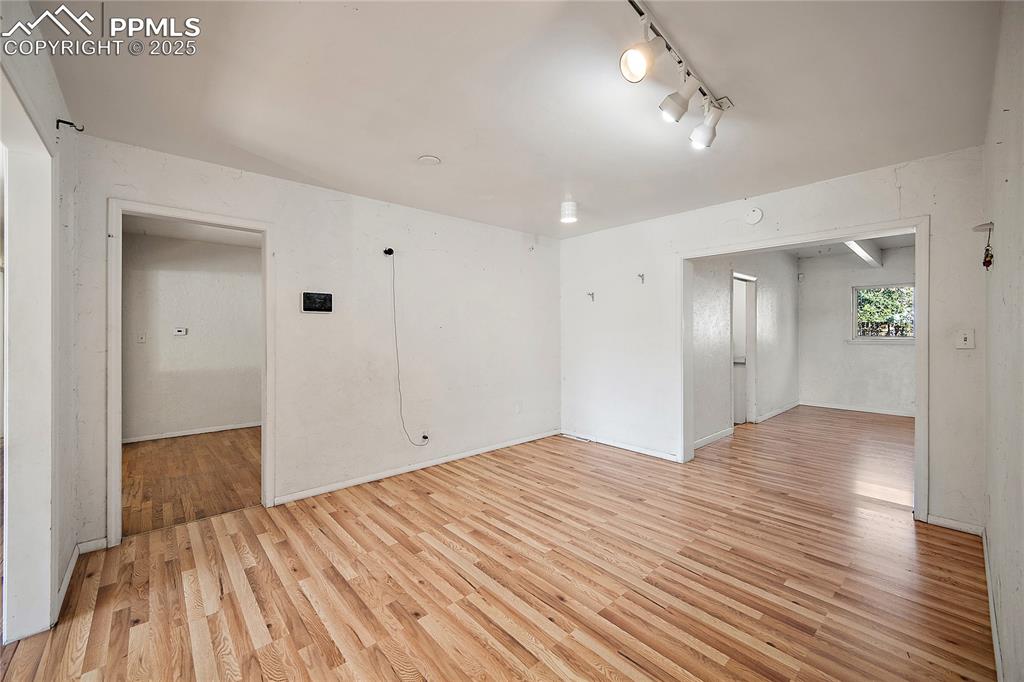 secondary dining or living area opening up to formal dining area and family room.