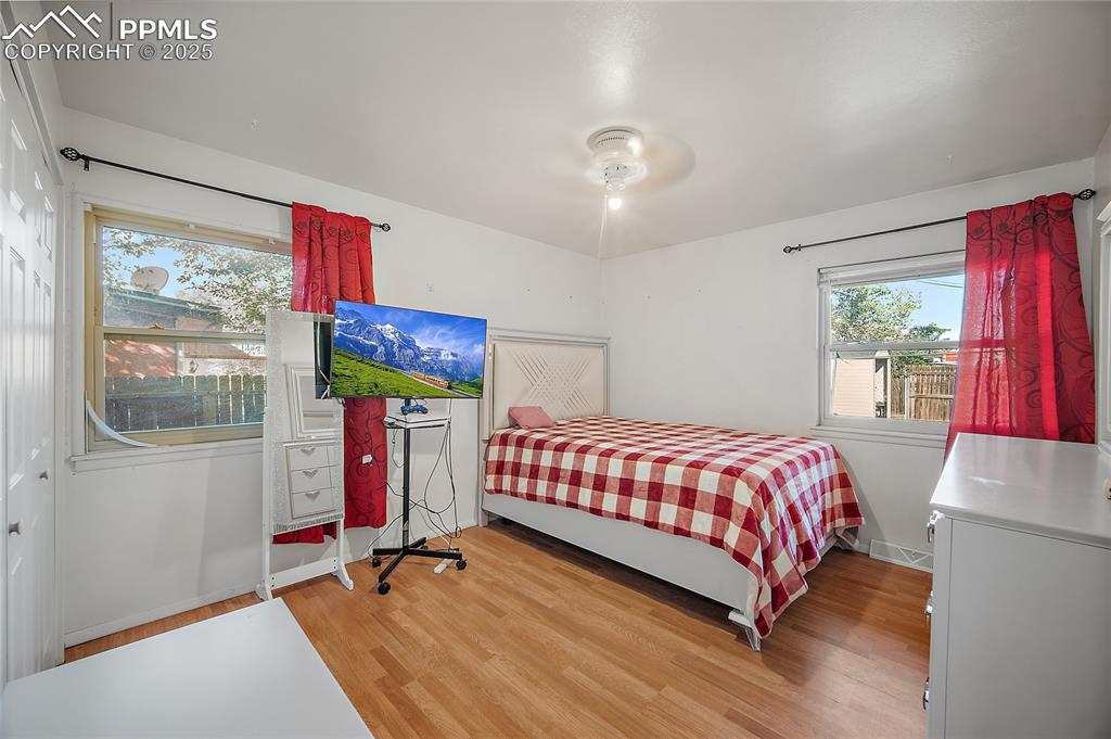 Bedroom featuring light wood-style flooring and ceiling fan