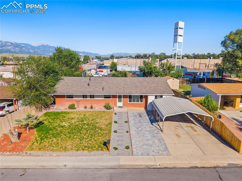 View of subject property with mountains