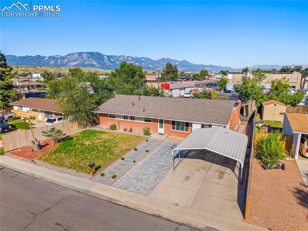 View of subject property featuring mountains