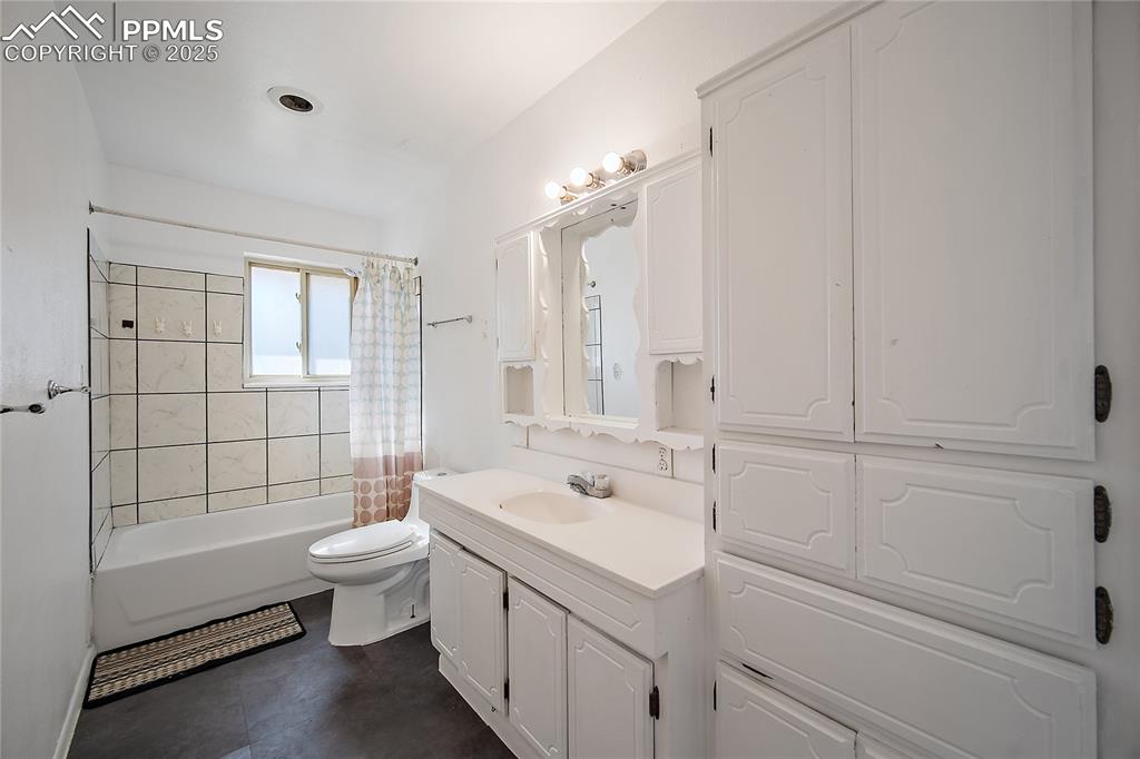 Full bathroom featuring vanity and shower / tub combo
