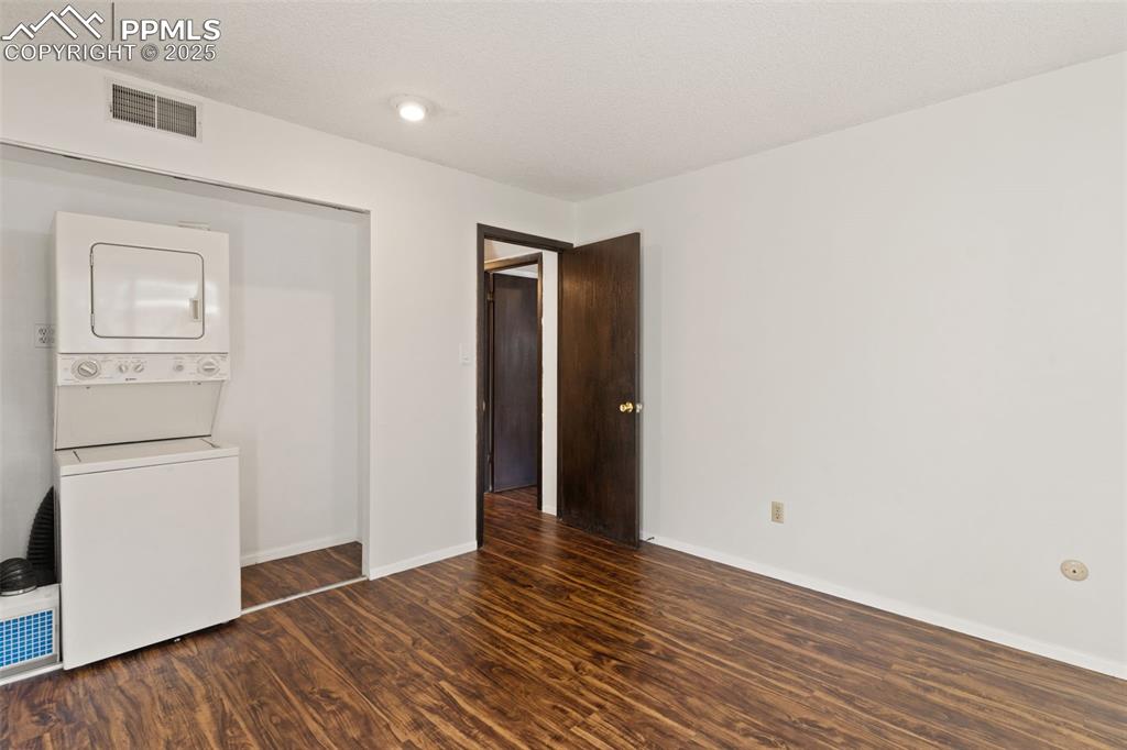 Second bedroom with laundry hook ups could be used as office, storage, or rec room.