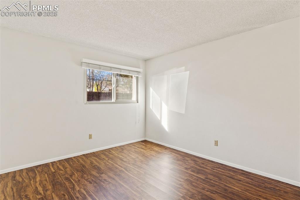 Bedrooms with LVP, window coverings, and new windows