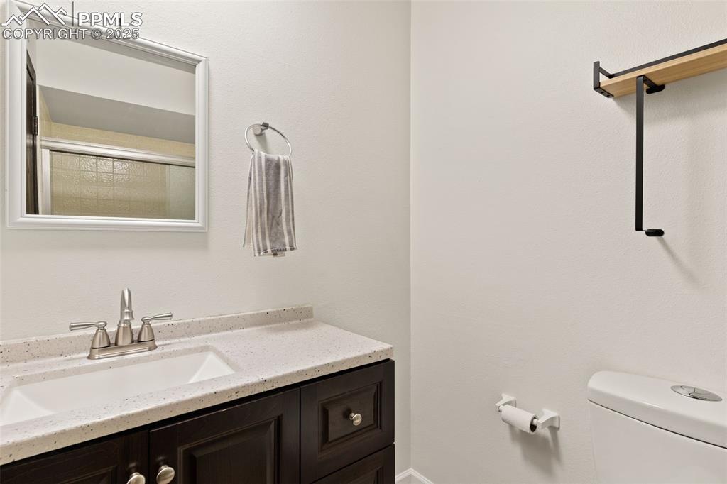 Full bathroom on lower level with updated vanity