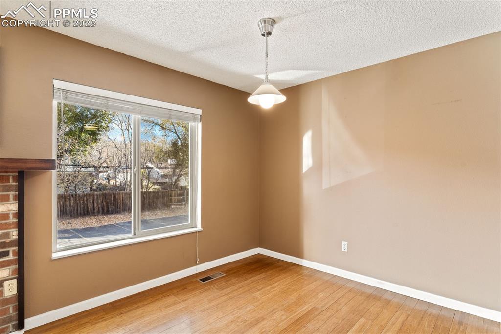 Dining area with overhead light and bright natural light