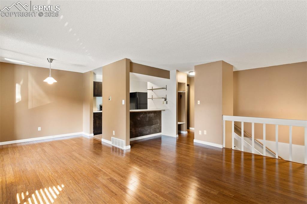 Lots of open space and light in the open concept living on the upper level