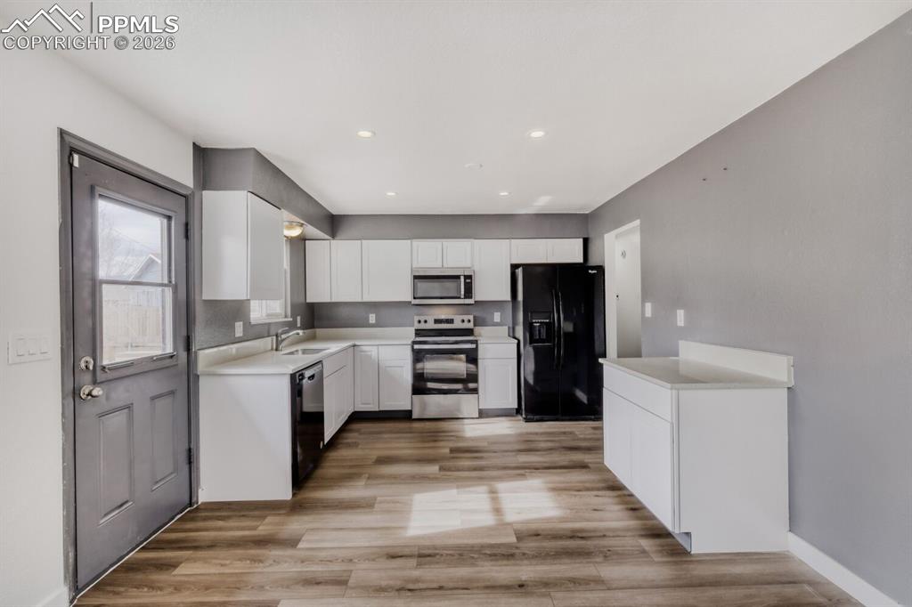 Upper Level-Kitchen featuring new cabinets and quartz countertops