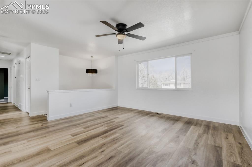 Upper Level-Living room with fresh paint and new ceiling fan