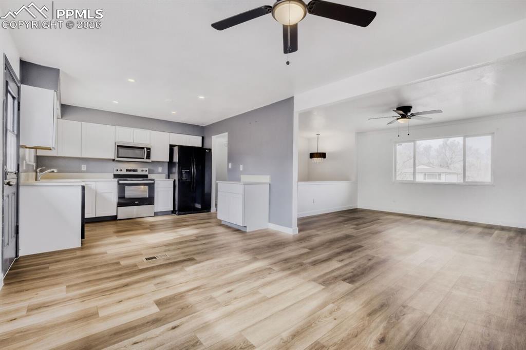 Upper Level-View of kitchen, dining and living rooms