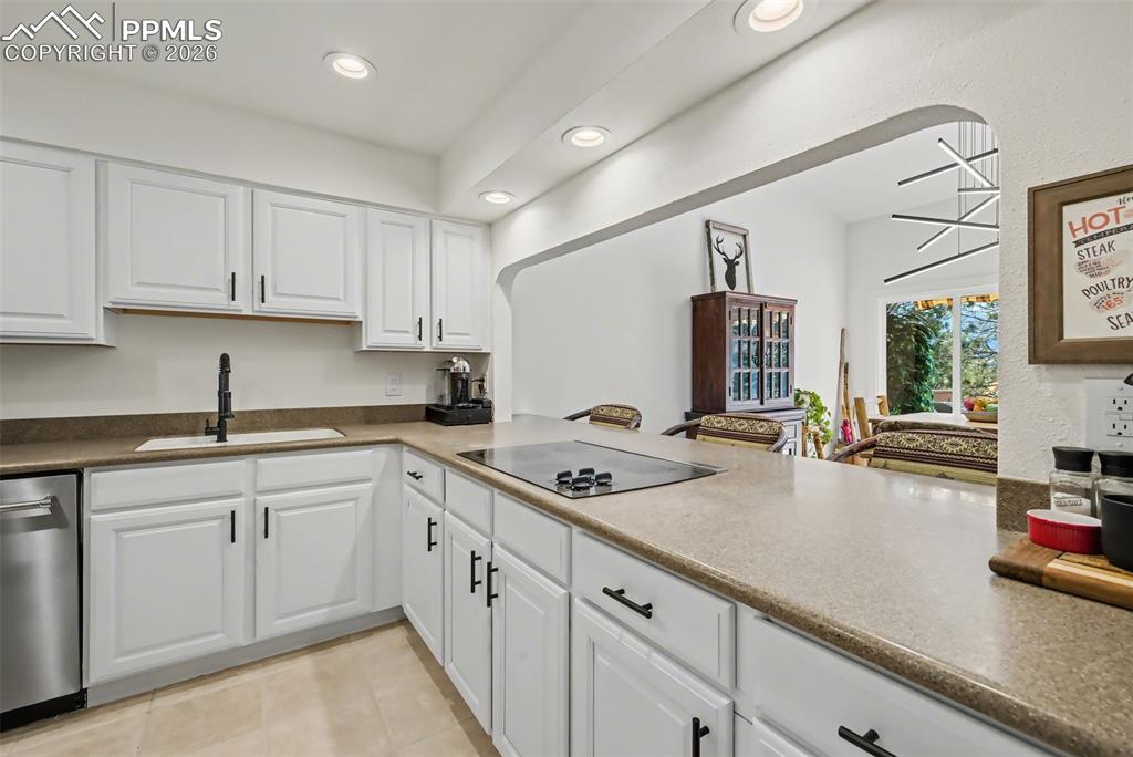 Opens to the dining area with breakfast bar 