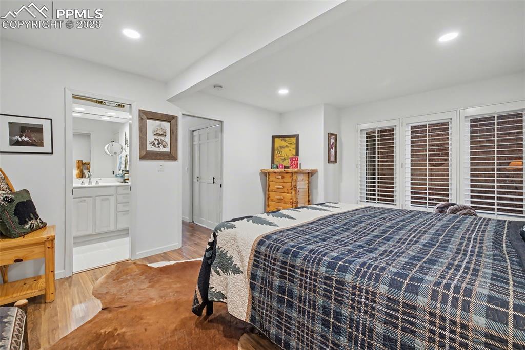 Primary suite with walk in closets and plantations shutters