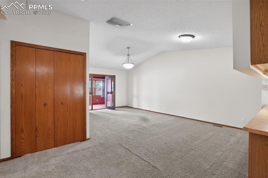 From the Hallway, looking into the Living Room leading to the Bonus Rooom