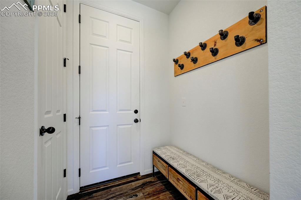 Mudroom with dark wood-style floors