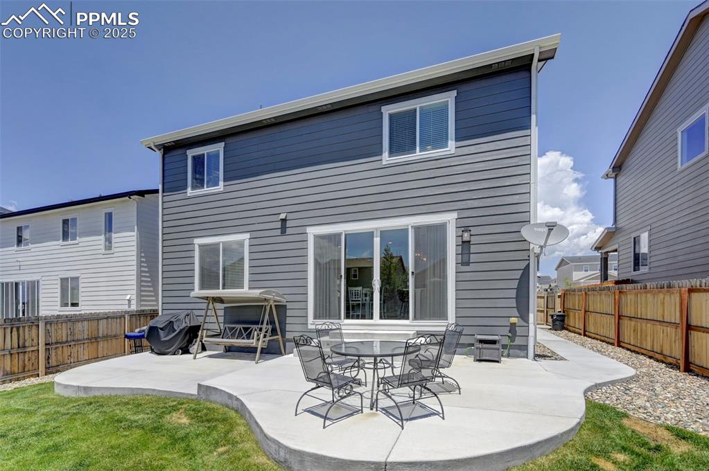 Back of house featuring a patio and a fenced backyard