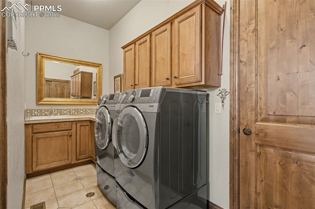 Convenience meets style in the thoughtfully designed, main-level laundry room with sink and access to the garage.
