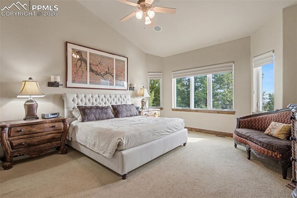 Retreat to the luxurious primary suite, a peaceful sanctuary offering true comfort and picturesque views.