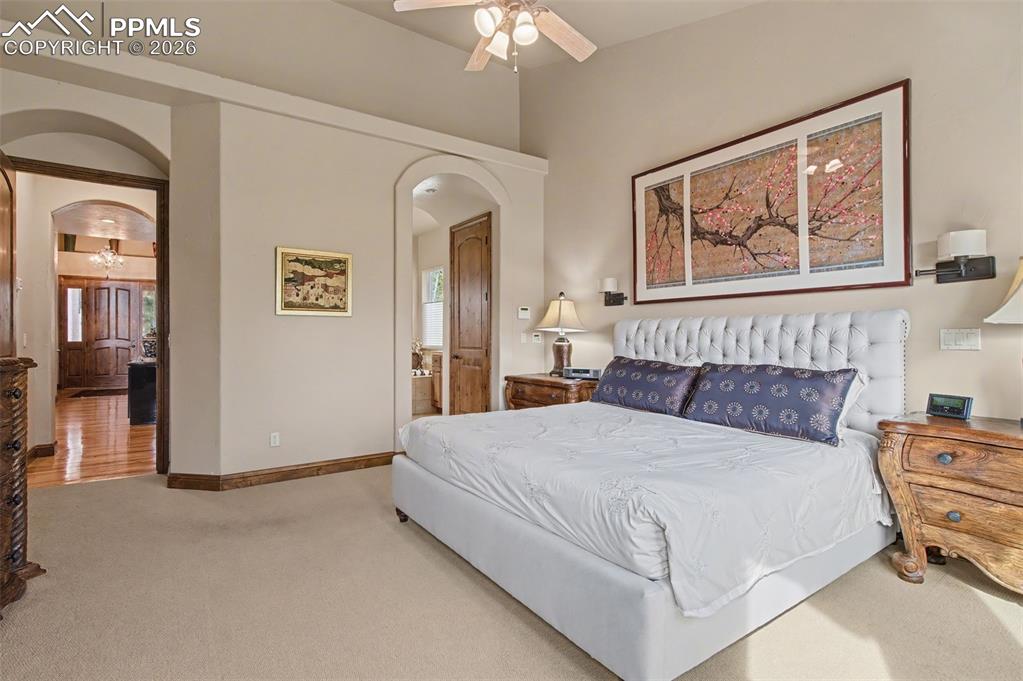 Spacious and sophisticated, the primary bedroom boasts an adjoining walk-in closet and bathroom.