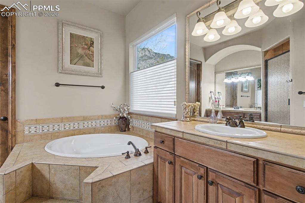 Unwind from the day in the spa-like 5-piece primary bathroom featuring a deep, relaxing soaking tub.