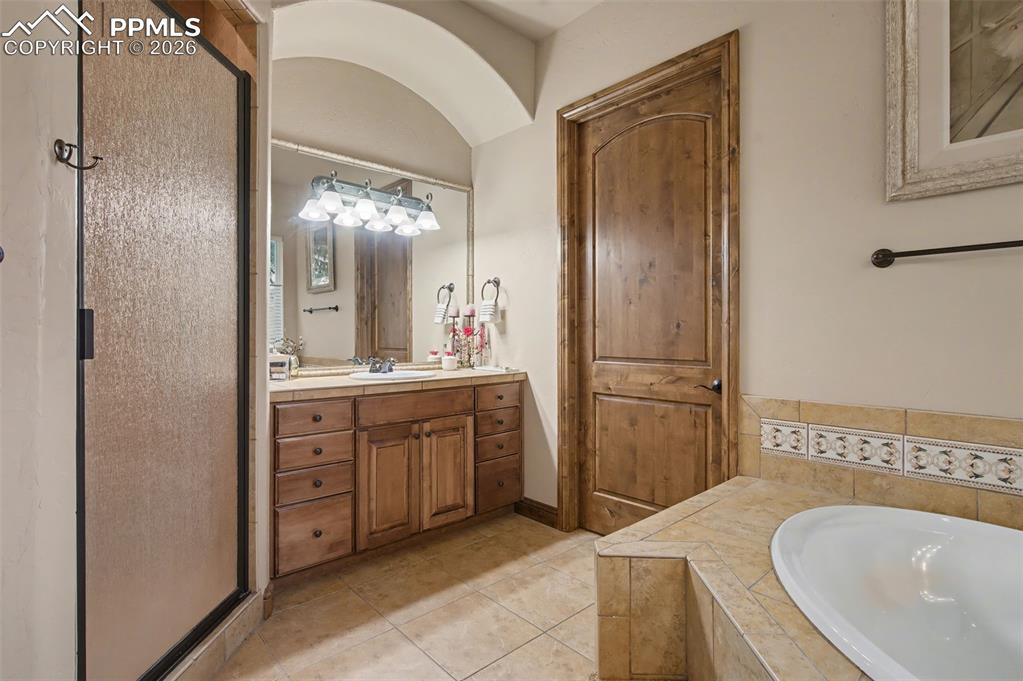 A free-standing shower completes this private owner's oasis