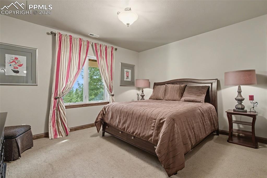 Your visitors will feel right at home in this private, spacious, and bright guest bedroom
