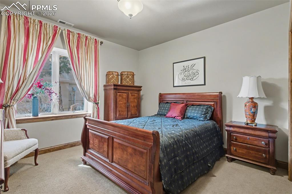 A second private guest bedroom on the basement level offers ultimate comfort and privacy for family or friends