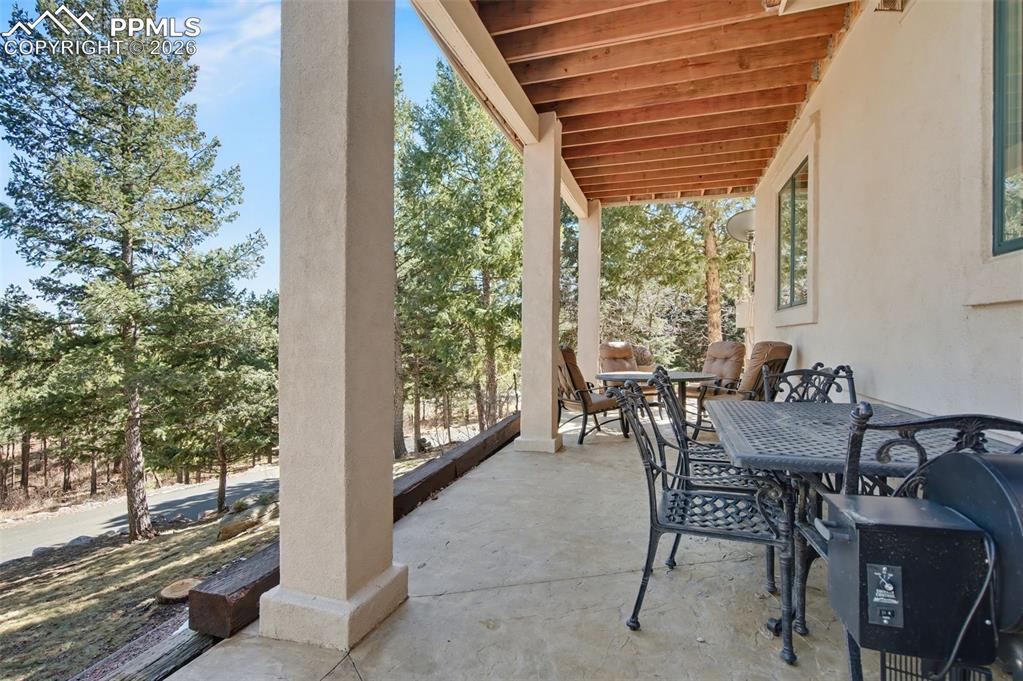 Relax in the shade of the covered walkout patio and let the tranquility of the rustling trees wash over you
