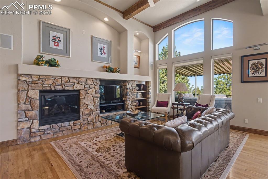 Gather around the stunning stone finished, gas log fireplace for warm, relaxing evenings at home