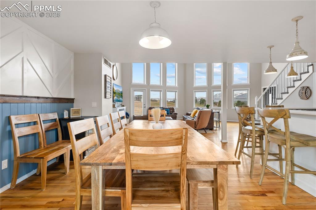 View from dining area looking toward the living room with the large windows.