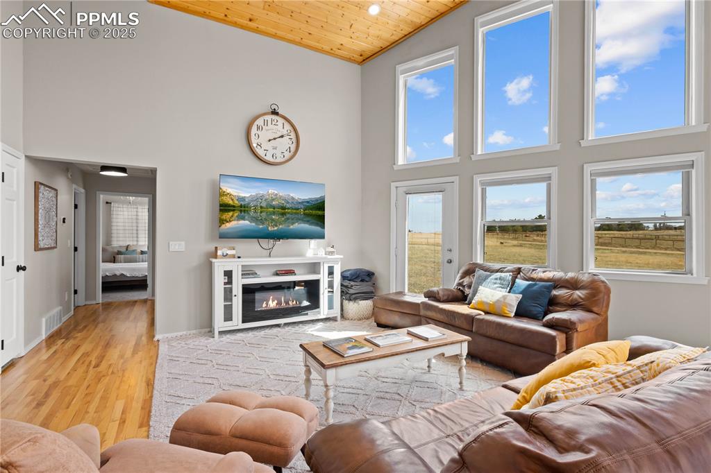 Hallway leads down to two bedrooms and full bathroom and coat closet. 